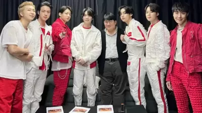 BTS members RM, Jin, Jungkook, Suga, V, Jimin, and J-Hope with Bang Si-hyuk.