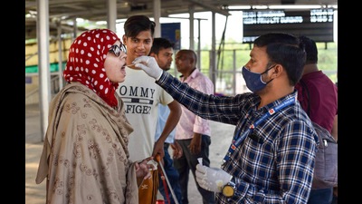 A health care worker collects a swab sample from a passenger for Covid-19 testing, Prayagraj, May 10, 2022 (PTI) A health care worker collects a swab sample from a passenger for Covid-19 testing, Prayagraj, May 10, 2022 (PTI)