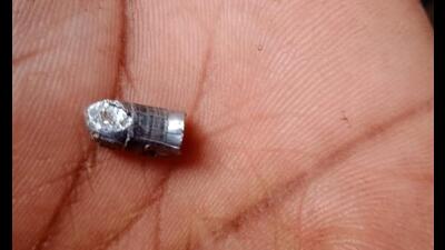 The bullet that injured a 17-year-old girl during an NCC training session in Shahapur village on Saturday. (HT PHOTO)