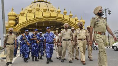 Rapid Action Force and Punjab Police personnel deployed at the Golden Gate ahead of Op Bluestar anniversary in Amritsar. (HT Photo)