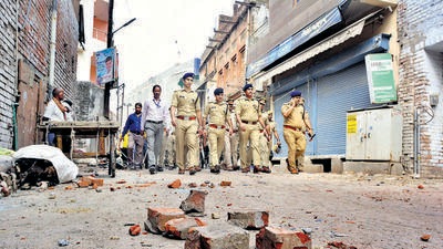 Police conduct a flag march in a clash-affected locality in Kanpur on Saturday. (PTI) Police conduct a flag march in a clash-affected locality in Kanpur on Saturday. (PTI)