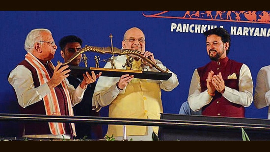 Union home minister Amit Shah (centre) with Haryana chief minister Manohar Lal Khattar and Union minister Anurag Thakur in Panchkula on Saturday. (Sant Arora/HT)