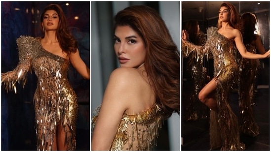 Jacqueline slipped into a one-shoulder gown for IIFA Awards 2022. Her ensemble comes in dual silver and gold metallic shades. It features endless tassels, beads, spiked and sequinned embellishments done on a nude backdrop, a bodycon silhouette, a thigh-high slit on the front, raised detail on the shoulder, a long sleeve, and a floor-grazing hem.(Instagram/@jacquelinef143)