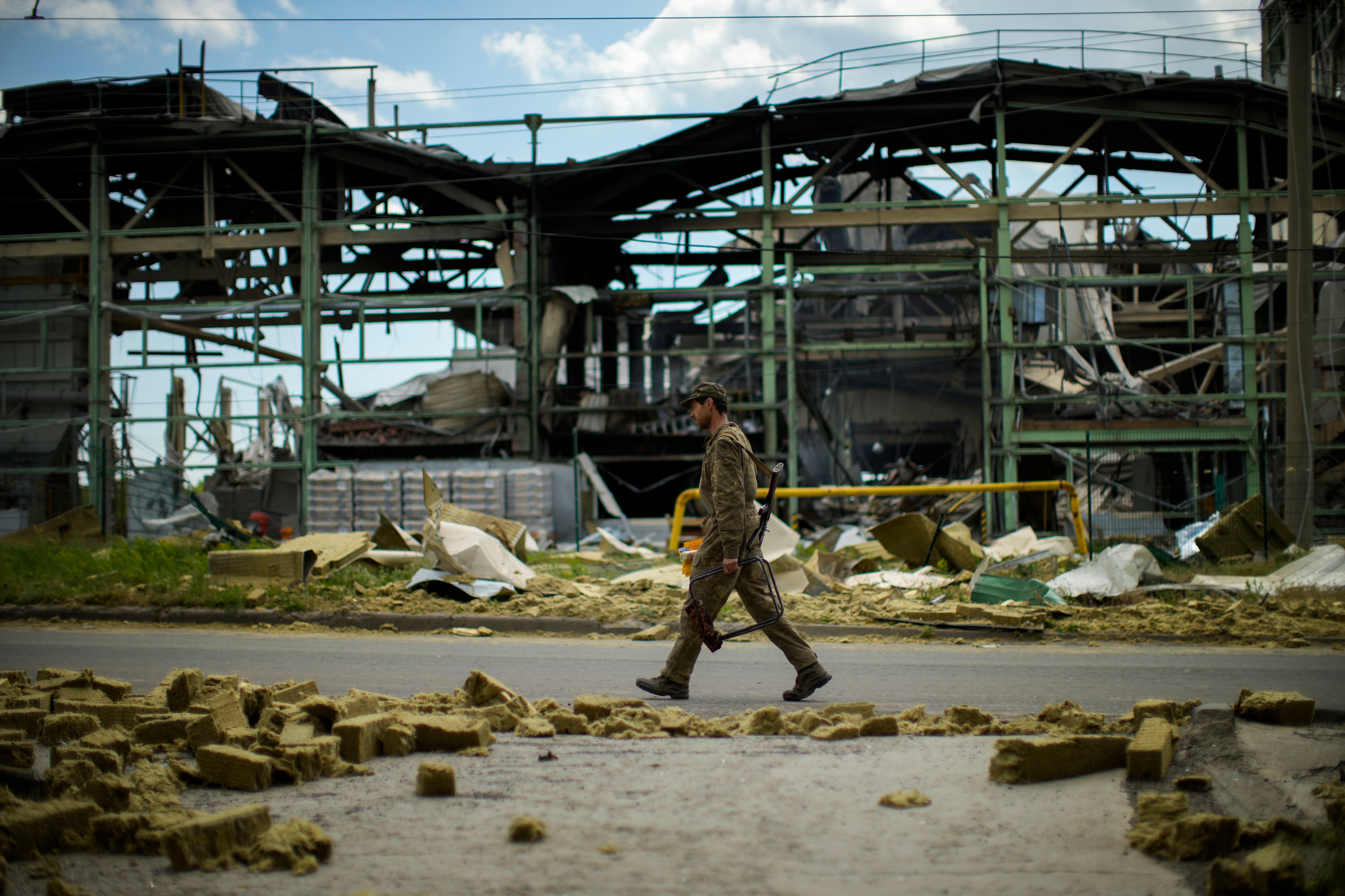 A Ukrainian serviceman walks past a gypsum manufacturing plant destroyed in a Russian bombing in Bakhmut, eastern Ukraine. (AP photo) A Ukrainian serviceman walks past a gypsum manufacturing plant destroyed in a Russian bombing in Bakhmut, eastern Ukraine. (AP photo)