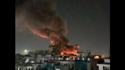 Flames and smoke billow out of Satwari Police station that caught a massive fire, in Jammu on Sunday. (ANI)