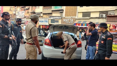 Police and paramilitary force checking a vehicle at Chaura Bazaar in Ludhiana on Sunday on the eve of the anniversary of Operation Bluestar. (Harvinder Singh/HT)