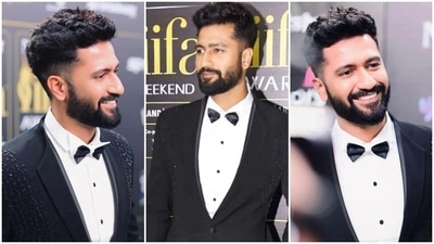 Vicky's full look for IIFA Awards features a black blazer with single lapel collars, shimmering black embellishments on the front, padded shoulders, sculpted fitting hugging the actor's frame, double-layered silhouette, long sleeves and a buttoned-up front. He layered the blazer over a classic white button-up shirt and straight-fitted black pants. (Instagram) Vicky's full look for IIFA Awards features a black blazer with single lapel collars, shimmering black embellishments on the front, padded shoulders, sculpted fitting hugging the actor's frame, double-layered silhouette, long sleeves and a buttoned-up front. He layered the blazer over a classic white button-up shirt and straight-fitted black pants. (Instagram)