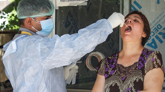 A healthworker collects swab samples for Covid-19 testing.(PTI File Photo) A healthworker collects swab samples for Covid-19 testing.(PTI File Photo)