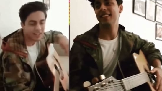 Aryan Khan playing a guitar in a video.&nbsp;