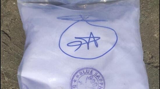 The words ‘Café Gourmet’ and ‘Blue Sapphire 555’ are printed on the packets containing the drugs seized at Gujarat’s Jakhau port . (HT PHOTO.)
