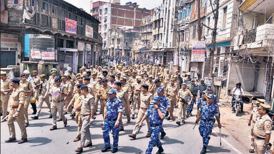 Security personnel patrol to maintain law and order in Kanpur on Sunday. (PTI)