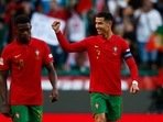Portugal's Cristiano Ronaldo celebrates scoring their second goal with Nuno Mendes&nbsp;