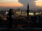 A visitor photographs the city skyline from Ankara castle at dusk in Ankara, Turkey. Turkey's inflation soared in May to the fastest since 1998 as it came under more pressure from the rising cost of food and energy while ultra-loose monetary policy contributed to currency weakness. (Photographer: SeongJoon Cho/Bloomberg) A visitor photographs the city skyline from Ankara castle at dusk in Ankara, Turkey. Turkey's inflation soared in May to the fastest since 1998 as it came under more pressure from the rising cost of food and energy while ultra-loose monetary policy contributed to currency weakness. (Photographer: SeongJoon Cho/Bloomberg)