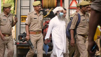 Varanasi serial blast convict Waliullah being escorted by the police after he was sentenced to death by a court, in Ghaziabad on Monday. (Sakib Ali / HT) Varanasi serial blast convict Waliullah being escorted by the police after he was sentenced to death by a court, in Ghaziabad on Monday. (Sakib Ali / HT)