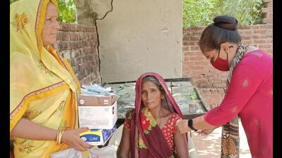 A woman being administered Covid vaccine dose under ‘Har Ghar Dastak’ campaign, in Lucknow’s Sarojini Nagar (Sourced) A woman being administered Covid vaccine dose under ‘Har Ghar Dastak’ campaign, in Lucknow’s Sarojini Nagar (Sourced)