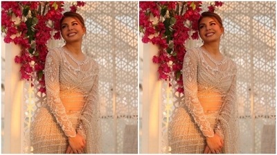 Jacqueline decked up in a see-through white saree heavily embellished in white resham threads, zari and pearls. She paired it with a white blouse featuring embellishments in white threads and pearls. (Instagram/@jacquelinef143)