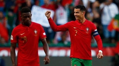 Portugal's Cristiano Ronaldo celebrates scoring their second goal with Nuno Mendes&nbsp; (REUTERS)