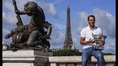 Spain's Rafael Nadal poses with his trophy at Alexander III bridge in Paris, June 6, 2022 (AP) Spain's Rafael Nadal poses with his trophy at Alexander III bridge in Paris, June 6, 2022 (AP)