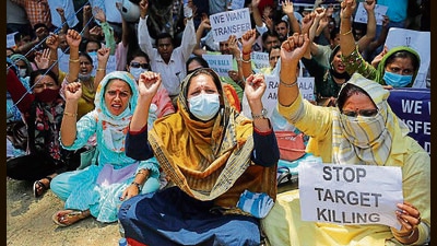 Chanting slogans and carrying placards, the protesters said the government should accede to the demands of the protesting PM package employees and temporarily transfer them to Jammu till the security situation in the Valley improves. (PTI) Chanting slogans and carrying placards, the protesters said the government should accede to the demands of the protesting PM package employees and temporarily transfer them to Jammu till the security situation in the Valley improves. (PTI)