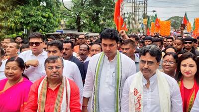 As Tripura chief minister Manik Saha walked to the local election office leading a group of BJP workers to file his nomination, Biplab Kumar Deb and his wife Niti Deb were by his side (Twitter/BjpBiplab) As Tripura chief minister Manik Saha walked to the local election office leading a group of BJP workers to file his nomination, Biplab Kumar Deb and his wife Niti Deb were by his side (Twitter/BjpBiplab)