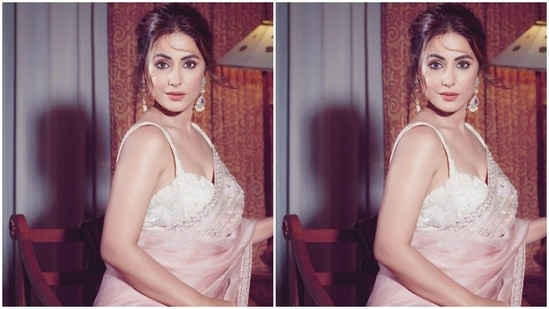 Hina’s organza saree featured minimal details in silver zari and moti. She paired it with a sleeveless white embellished white corset blouse.(Instagram/@realhinakhan)