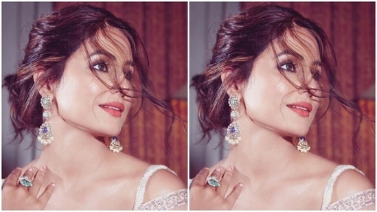 Hina accessorised her look for the day in statement silver danglers embedded with emerald, blue and white stones and a ring from the shelves of Razwada Jewels.(Instagram/@realhinakhan)