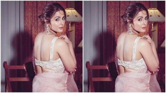 Assisted by makeup artist Sachin Salvi, Hina decked up in nude eyeshadow, black eyeliner, black kohl, mascara-laden eyelashes, drawn eyebrows, contoured cheeks and a shade of soft red lipstick.(Instagram/@realhinakhan)