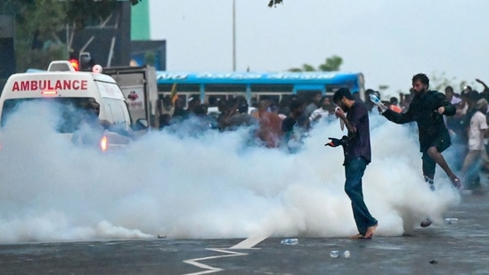 Police use tear gas shells to disperse students taking part in an anti-government protest demanding the resignation of Sri Lanka's President Gotabaya Rajapaksa over the country's crippling economic crisis, in Colombo (AFP)