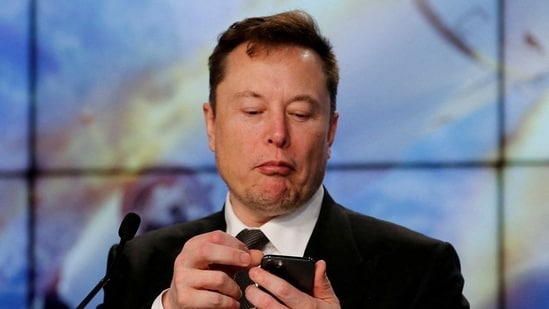 Elon Musk looks at his mobile phone in Cape Canaveral, Florida. (File image)(REUTERS)