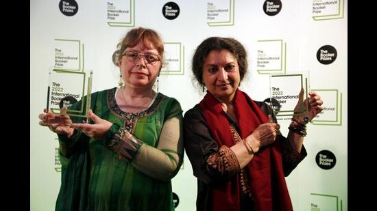 Author Geetanjali Shree, right, and translator Daisy Rockwell pose with the 2022 International Booker Prize for Translated Fiction in London, Thursday, May 26, 2022. (David Cliff/AP)