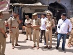 Police personnel stand guard at the Parade Chauraha area after violence broke out between two groups on June 3. (ANI Photo) Police personnel stand guard at the Parade Chauraha area after violence broke out between two groups on June 3. (ANI Photo)