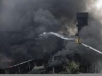 Bangladeshi firefighters work to put out a huge fire at the site of an explosion in a factory(AFP) Bangladeshi firefighters work to put out a huge fire at the site of an explosion in a factory(AFP)