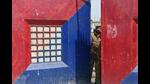 A J&K policeman looks through the gate of the central jail in Srinagar. (AFP File Photo) A J&K policeman looks through the gate of the central jail in Srinagar. (AFP File Photo)