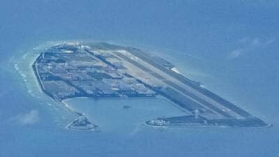 Chinese structures and buildings on the man-made Fiery Cross Reef at the disputed Spratlys group of islands in the South China Sea are seen on March 20, 2022. (AP) Chinese structures and buildings on the man-made Fiery Cross Reef at the disputed Spratlys group of islands in the South China Sea are seen on March 20, 2022. (AP)