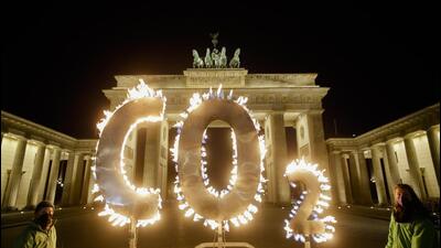 Activists of the environment organisation Greenpeace protest with CO2 letters illuminated with flames in front of the Brandenburg Gate against the climate crisis in Berlin, Germany, on May 6, 2021. (AP/FILE) Activists of the environment organisation Greenpeace protest with CO2 letters illuminated with flames in front of the Brandenburg Gate against the climate crisis in Berlin, Germany, on May 6, 2021. (AP/FILE)