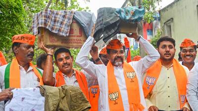 BJP MLC Narayan Swamy and party members carrying shorts protest against Congress leader Siddaramaiah’s alleged Chadi remark, in Bengaluru on Tuesday. (PTI) BJP MLC Narayan Swamy and party members carrying shorts protest against Congress leader Siddaramaiah’s alleged Chadi remark, in Bengaluru on Tuesday. (PTI)