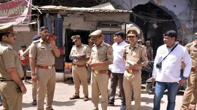 Police personnel stand guard at the Parade Chauraha area for the fourth consecutive day after violence broke out between two groups on June 3rd, in Kanpur. (ANI Photo) Police personnel stand guard at the Parade Chauraha area for the fourth consecutive day after violence broke out between two groups on June 3rd, in Kanpur. (ANI Photo)
