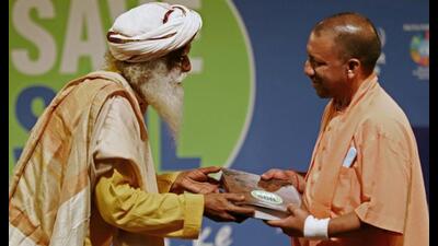 Uttar Pradesh chief minister Yogi Adityanath along with spiritual leader Sadhguru during the ‘Save Soil Movement’ event at CMS auditorium in Lucknow on Tuesday. (ANI Photo) Uttar Pradesh chief minister Yogi Adityanath along with spiritual leader Sadhguru during the ‘Save Soil Movement’ event at CMS auditorium in Lucknow on Tuesday. (ANI Photo)
