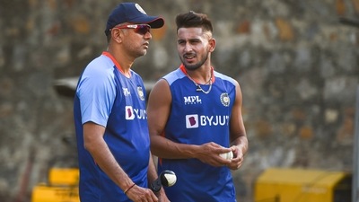 Indian cricket team head coach Rahul Dravid interacts with Umran Malik during a practice session (PTI) Indian cricket team head coach Rahul Dravid interacts with Umran Malik during a practice session (PTI)