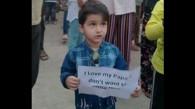 Children of Kashmiri Pandit migrant employees stage a protest demanding relocation of their parents to safer places, at Vessu camp in south Kashmir, on Tuesday. (PTI)