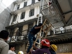 Firemen conduct rescue operations after a fire broke out at the basement's meter board in Lajpat Nagar area, in New Delhi on Wednesday. (ANI Photo)