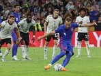 England's Harry Kane scores his side's opening goal during the UEFA Nations League soccer match between Germany and England at the Allianz Arena, in Munich.