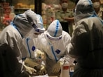 Health workers carrying out coronavirus tests in a shopping mall in Dalian (STR / AFP) Health workers carrying out coronavirus tests in a shopping mall in Dalian (STR / AFP)