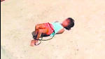 A video grab shows the girl, her hands and legs tied, on the terrace of her home in northeast Delhi’s Khajuri Khas. (Sourced) A video grab shows the girl, her hands and legs tied, on the terrace of her home in northeast Delhi’s Khajuri Khas. (Sourced)