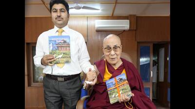 The Dalai Lama with author Sanjay Kumar Dhiman during the launch of book “Cultural and Natural Heritage of Himachal Pradesh”. (HT Photo)