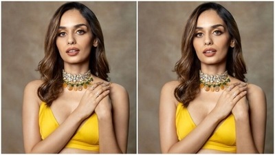 Styled by fashion stylist Sheela J Gilani, Manushi wore her tresses open in soft wavy curls and decked up in nude eyeshadow, black eyeliner, mascara-laden eyelashes, contoured cheeks and a shade of nude lipstick. (Instagram/@manushi_chhillar)