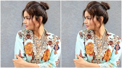 Rubina teamed a corset style pastel blue bra with quirky prints in multicolour with a cotton shirt-style shrug with quarter sleeves. She completed her look with a pair of pastel blue trousers with the same print. (Instagram/@rubinadilaik)