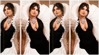 Styled by fashion stylist Law Roach, Priyanka wore her tresses into a messy bun and left a few strands of hair open around her face with a middle part as she posed for the pictures. (Instagram/@priyankachopra)