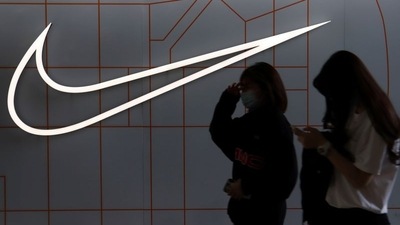 People walk past a store of the sporting goods retailer Nike Inc at a shopping complex in Beijing, China&nbsp; (REUTERS)