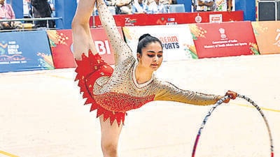 A gymnast performing at the Khelo India Youth Games at the Late Lt Mukesh Anand Sports Complex in Ambala. (HT Photo)